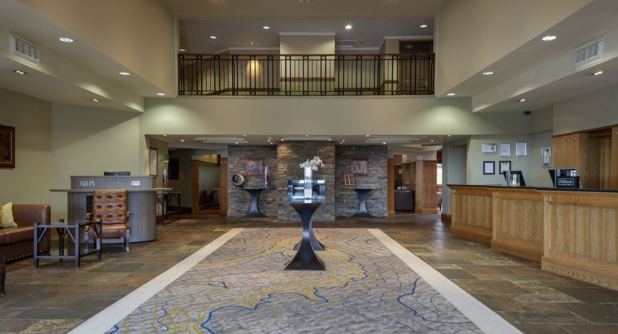 Lobby area with balcony at Glasgow Westerwood Hotel, Spa & Golf Resort