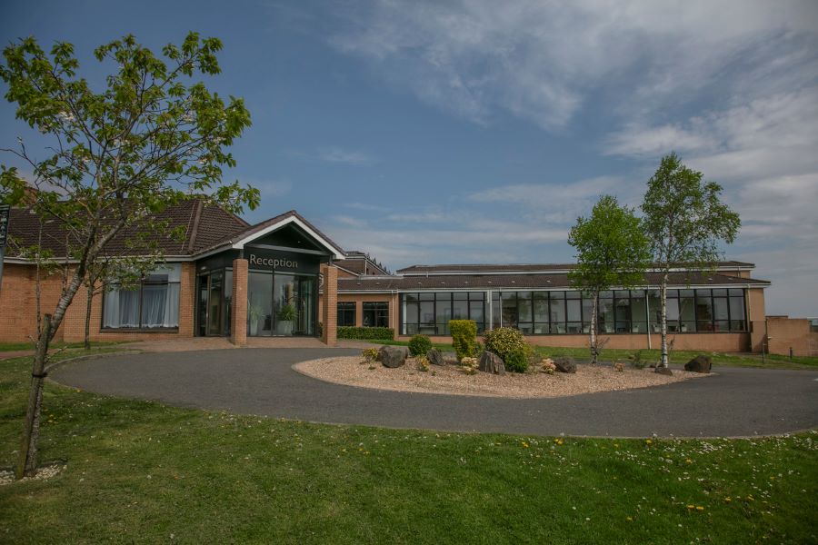 Exterior of Glasgow Westerwood Hotel, Spa & Golf Resort during the day