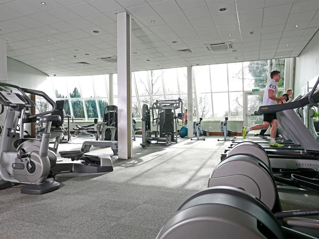 Guests on the treadmill in the gymnasium at MacDonald Portal Hotel Golf And Spa