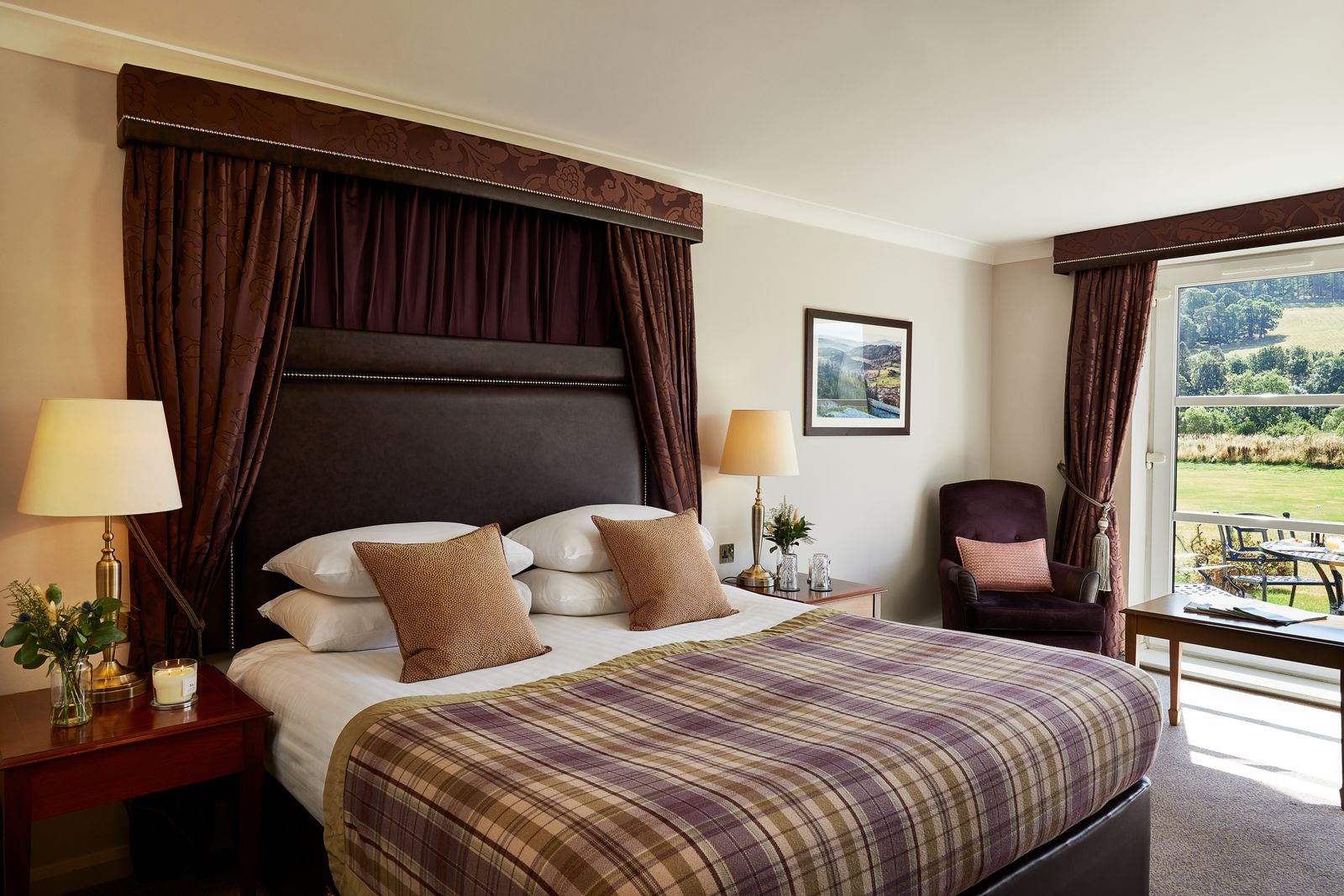 Bedroom with wooden headboard at Macdonald Cardrona Hotel