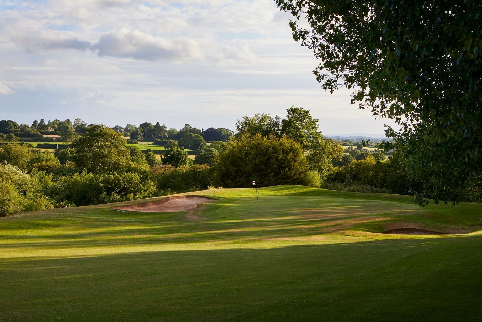 Golf course at Macdonald Hill Valley Hotel Golf & Spa with bunker on the left and putting green