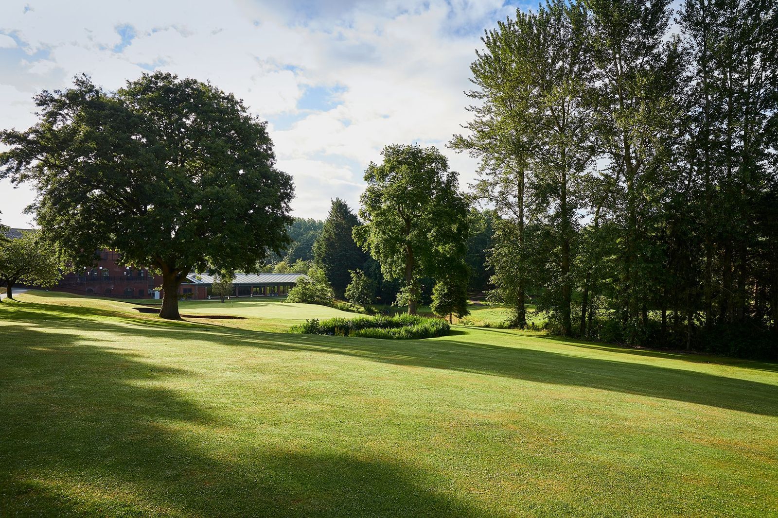 Macdonald Hill Valley Hotel Golf & Spa golf course with trees surrounding the fairway