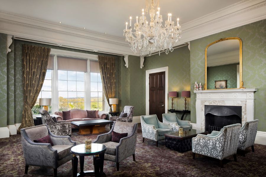 Lobby area with tables and chairs in grand room at Oulton Hall Golf Hotel And Spa