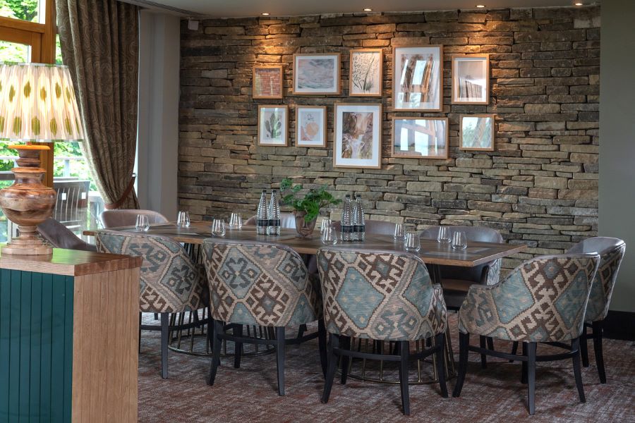 Dining table with chairs surrounding at Oulton Hall Golf Hotel And Spa