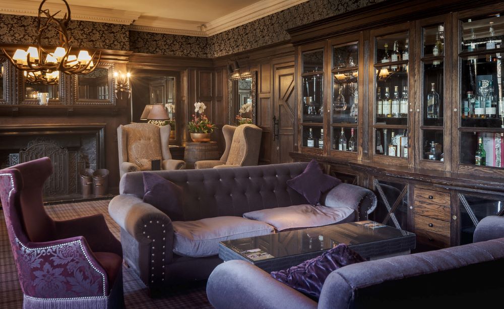 Purple sofas in lobby area at Slaley Hall Hotel, Spa And Golf Resort