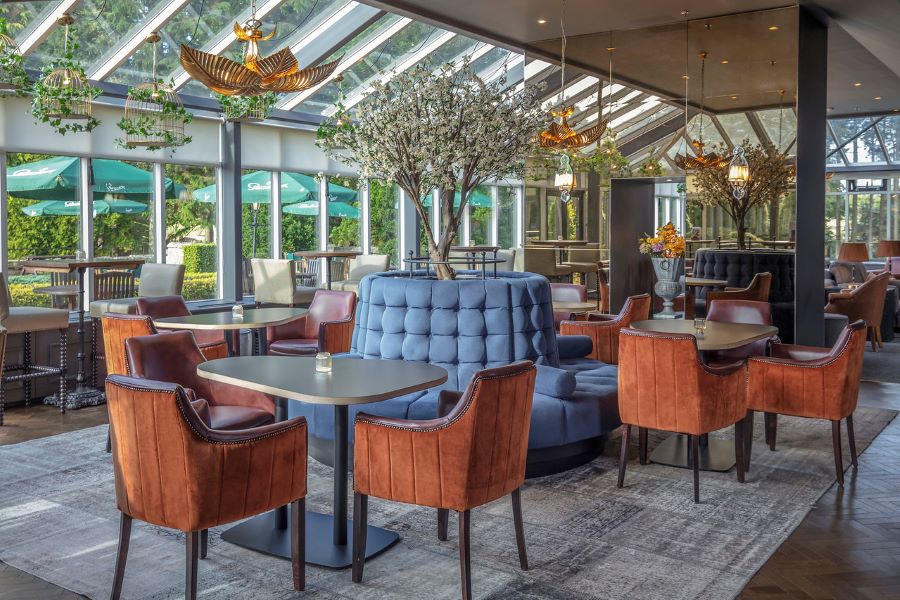 Orange chairs and blue benches at Slaley Hall Hotel, Spa And Golf Resort