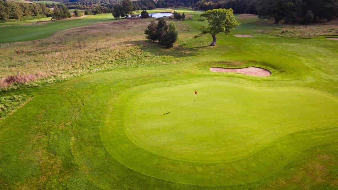 Putting green with red flag at Slaley Hall Hotel, Spa And Golf Resort