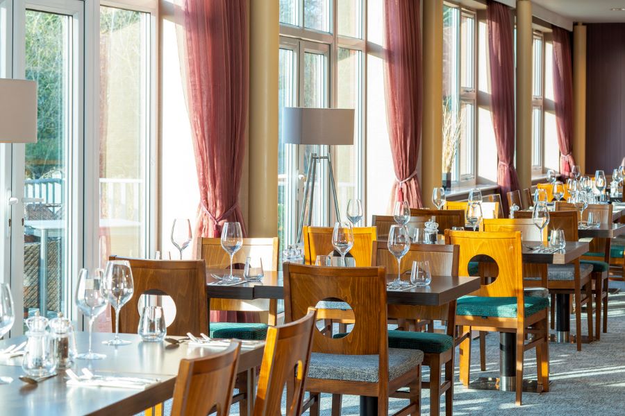 Dining room with chairs and tables set for service at The Telford Hotel, Spa And Golf Resort