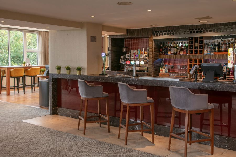 Red bar and grey stools at The Telford Hotel, Spa And Golf Resort
