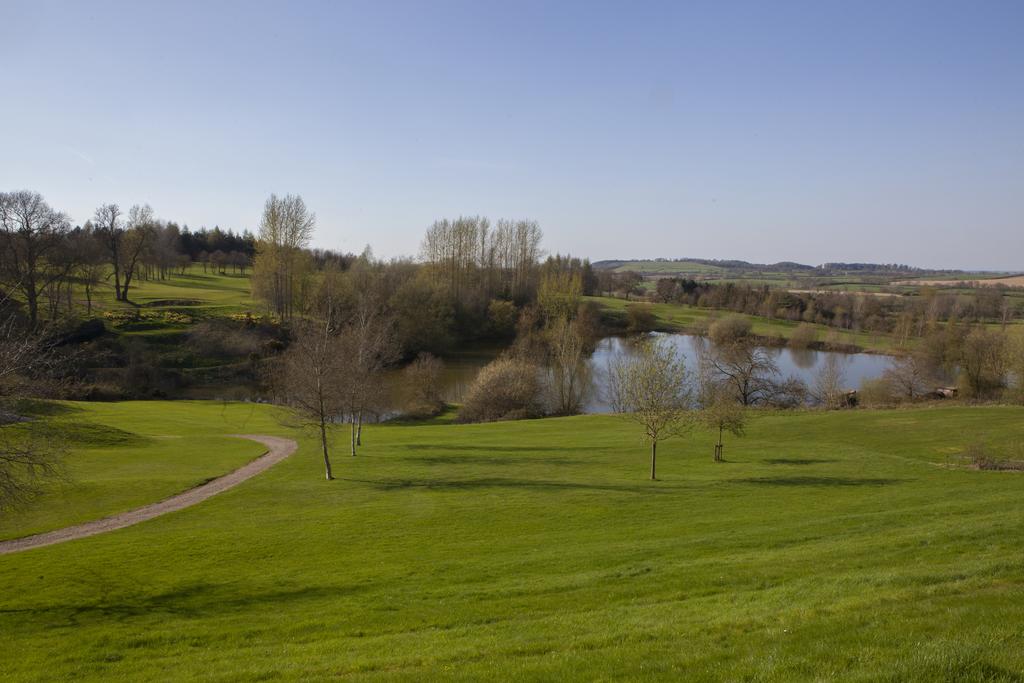 Surrounding golf course and trees at Hellidon Lakes Golf & Spa Hotel