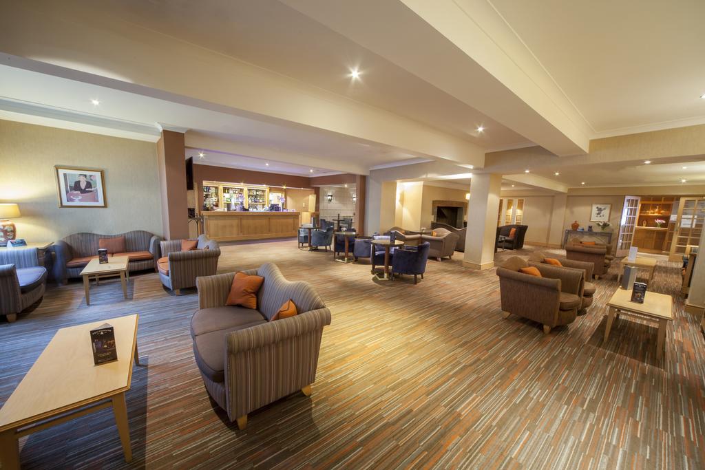 Bar with large seating area at Hellidon Lakes Golf & Spa Hotel
