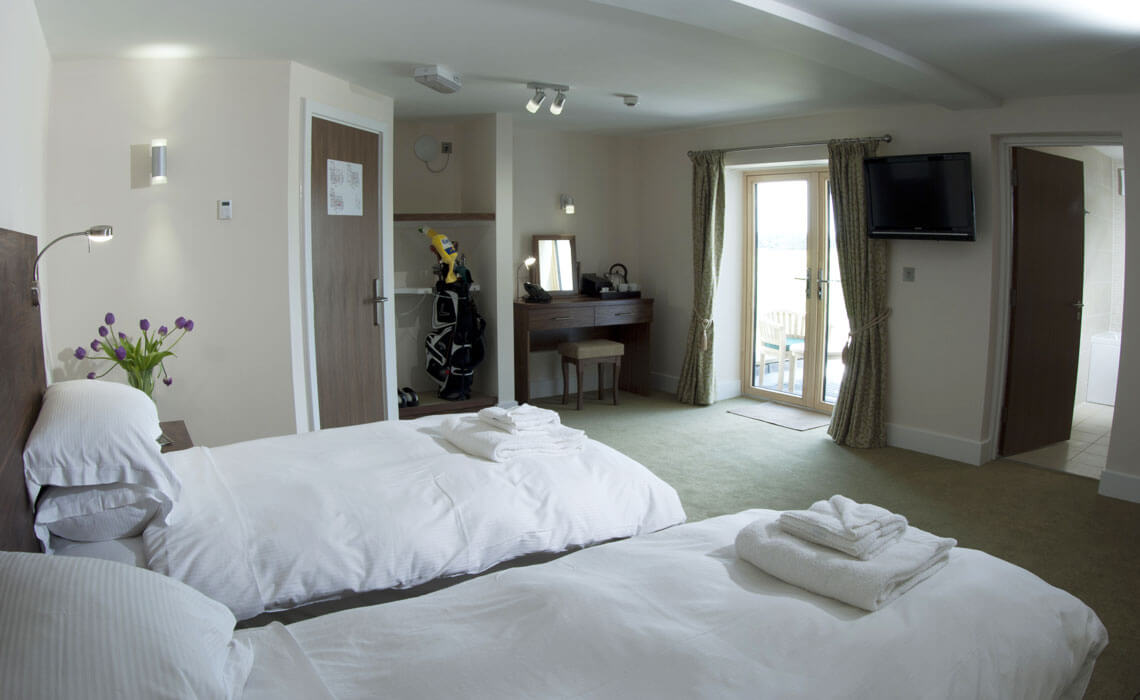 Twin Bedroom with wall mounted television at Prince's Golf Club