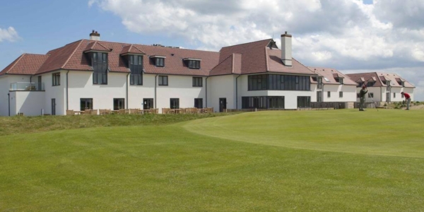 External view of Prince's Golf Club overlooking two golfers on the green