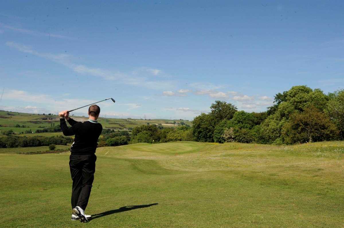 Golfer hitting a shot down the fairway to the green at The Westerwood Hotel And Golf Resort
