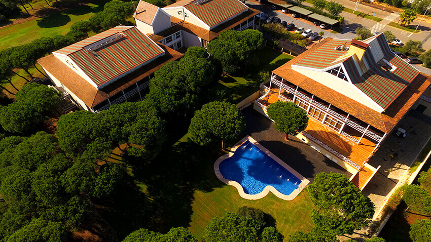 Arial shot of Hotel Nuevo Portil Golf overlooking the outdoor swimming pool