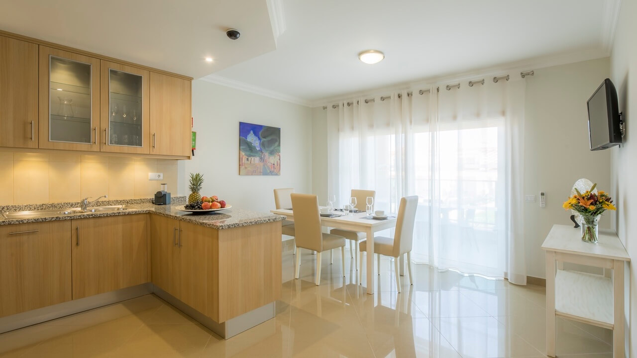 Kitchen and dining area in an apartment at Boavista Golf Resort And Spa