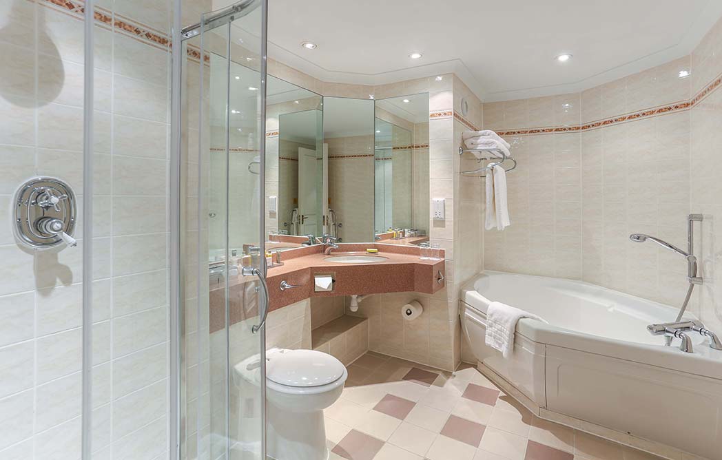 Bathroom with shower cubicle, toilet, sink and bath tub at Dalmahoy Hotel And Country Club