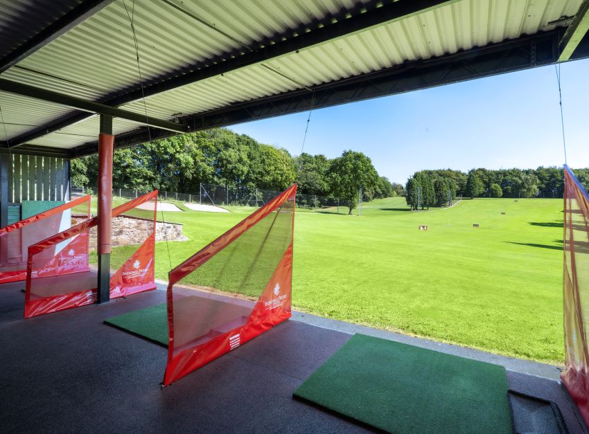 Driving range bay with mats at Delta Hotels by Marriott Breadsall Priory Country Club