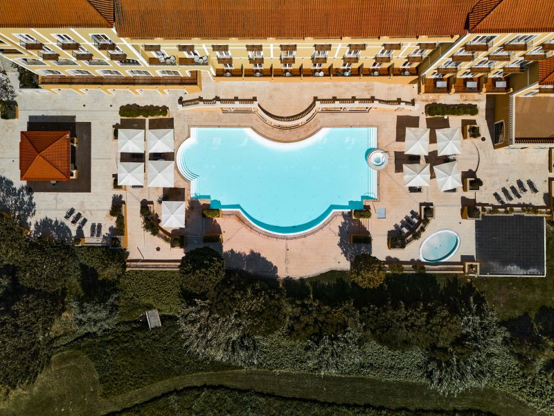 Overhead view of the outdoor pool at Dolce by Wyndham CampoReal Lisboa