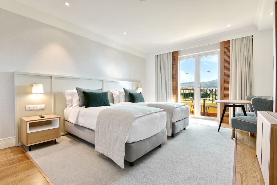 Twin beds in premium golf view room at Dolce by Wyndham CampoReal Lisboa