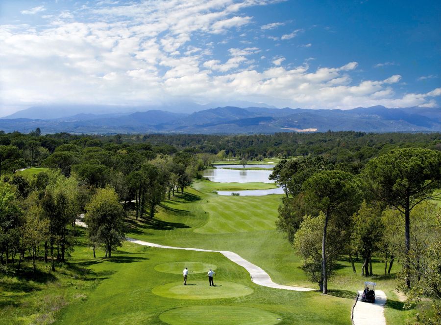 Golfers on the tee looking down the 13th's fairway at Camiral Golf's Stadium course