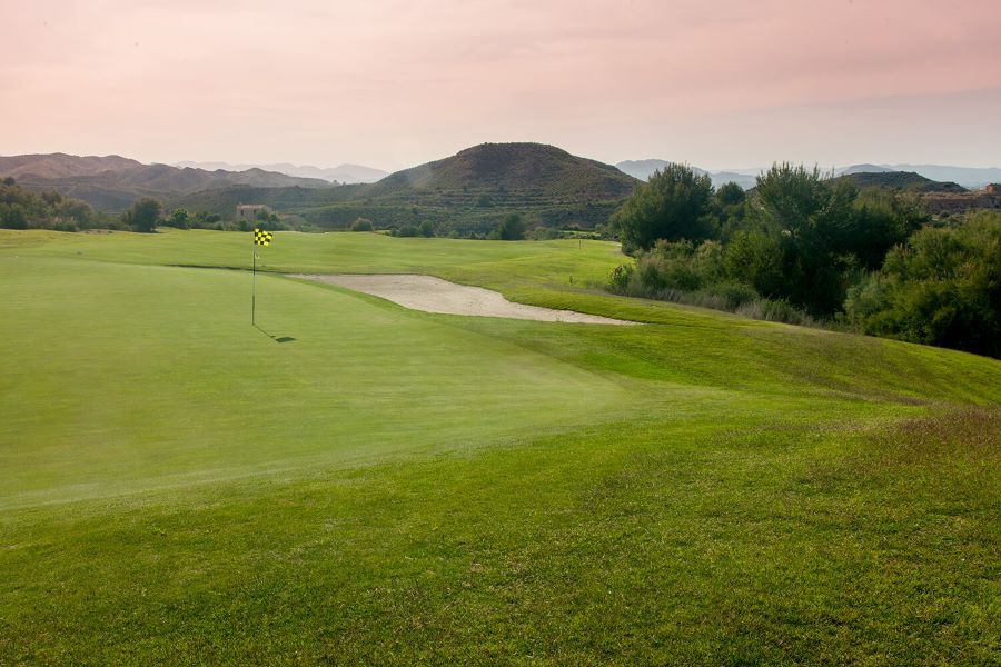 Sun setting over Font Del Llop golf course