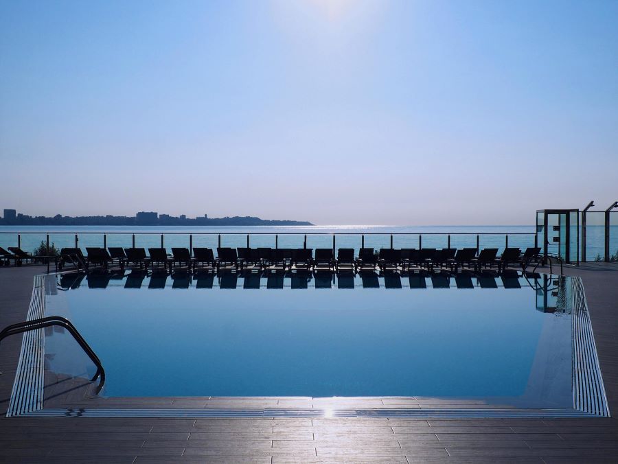 Swimming pool with sun loungers at Melia Alicante