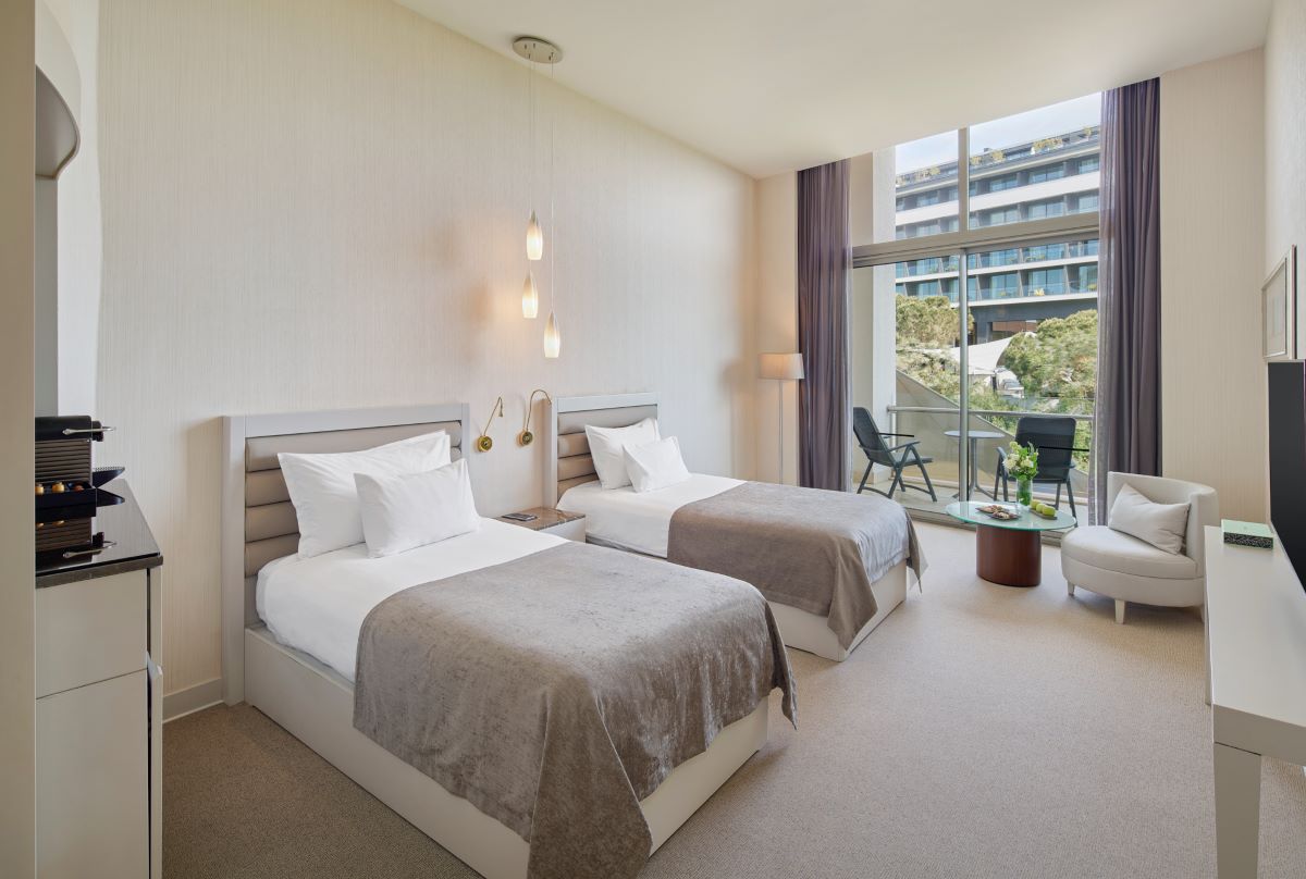 Twin beds in bedroom at Maxx Royal Golf & Spa