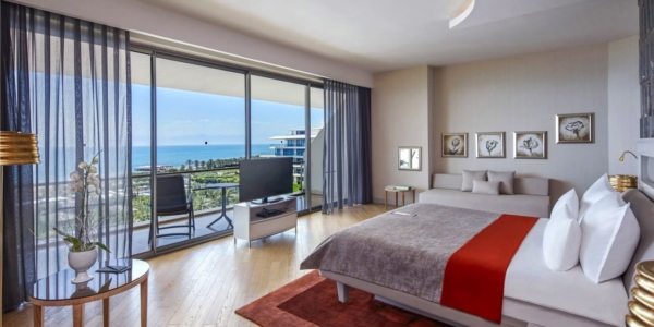 Double bedroom in Maxx Royal Golf And Spa Resort with flat screen television and views of the beach and sea
