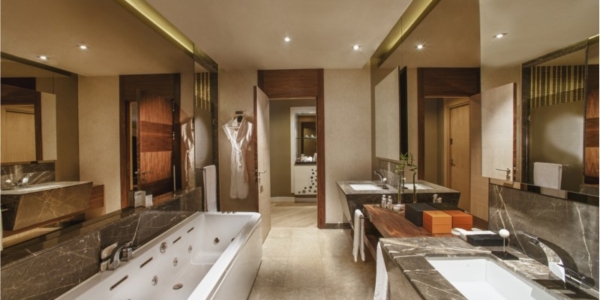 Bathroom with twin sinks, bath tub and separate shower cubicle at Maxx Royal Golf And Spa Resort