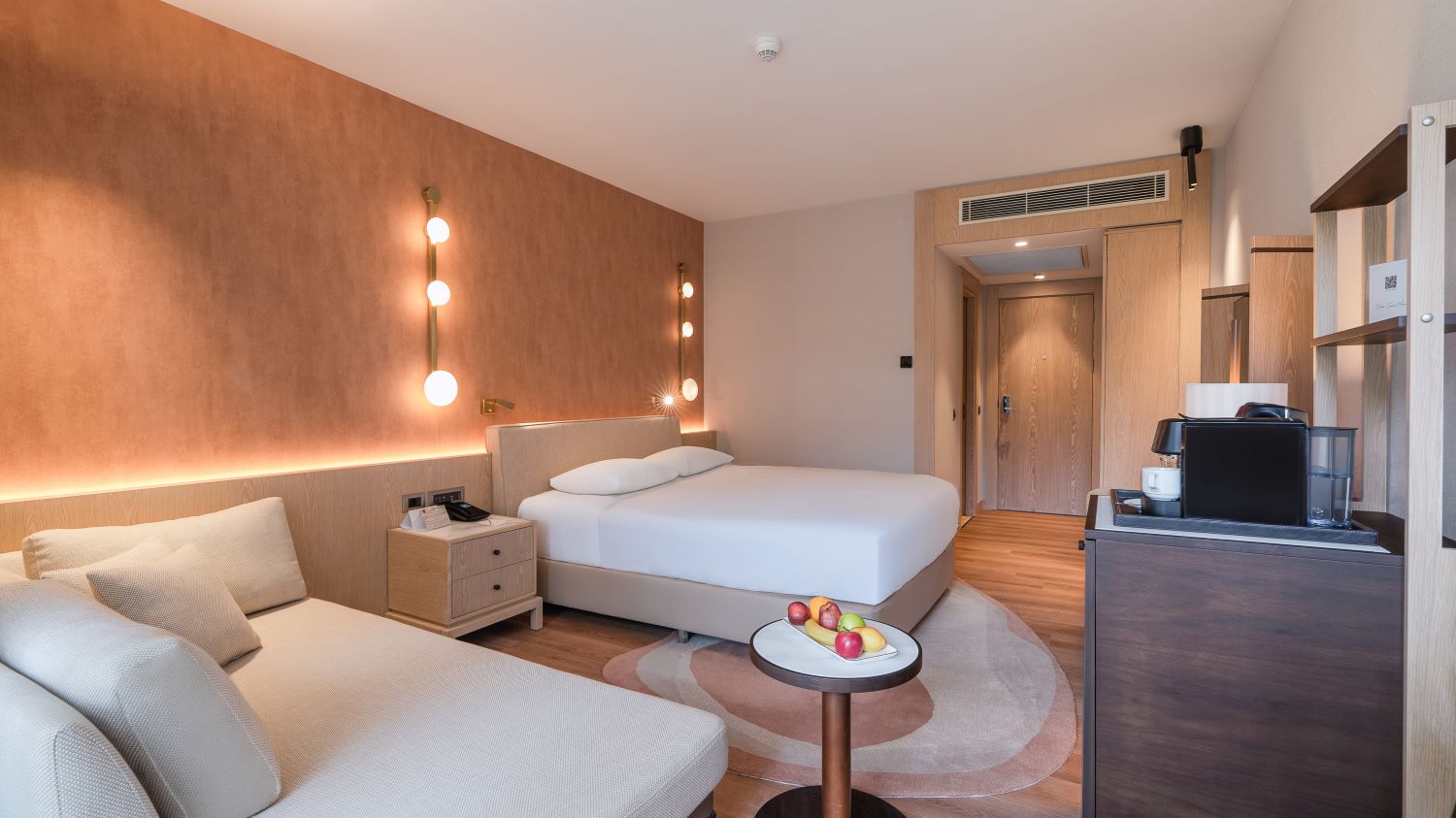 Bedroom with tv and sofa at Gloria Golf Resort in Belek