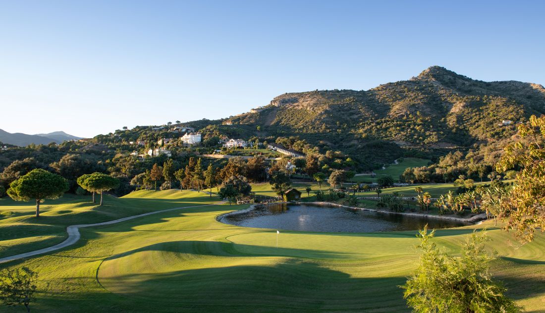Large bunker on the golf course with blue sky overhead at Marbella Club golf course