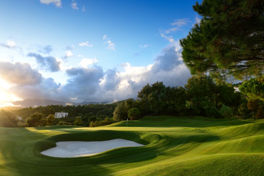 Large white sand bunker in front of the putting green at Marbella Club golf course