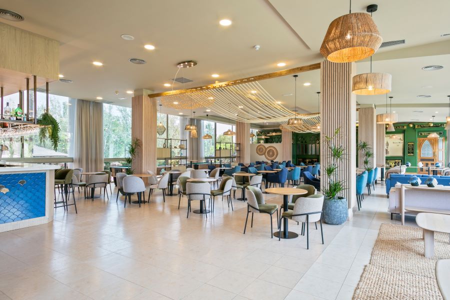 Tables and chairs in bar at Sol Costa Daurada by Melia