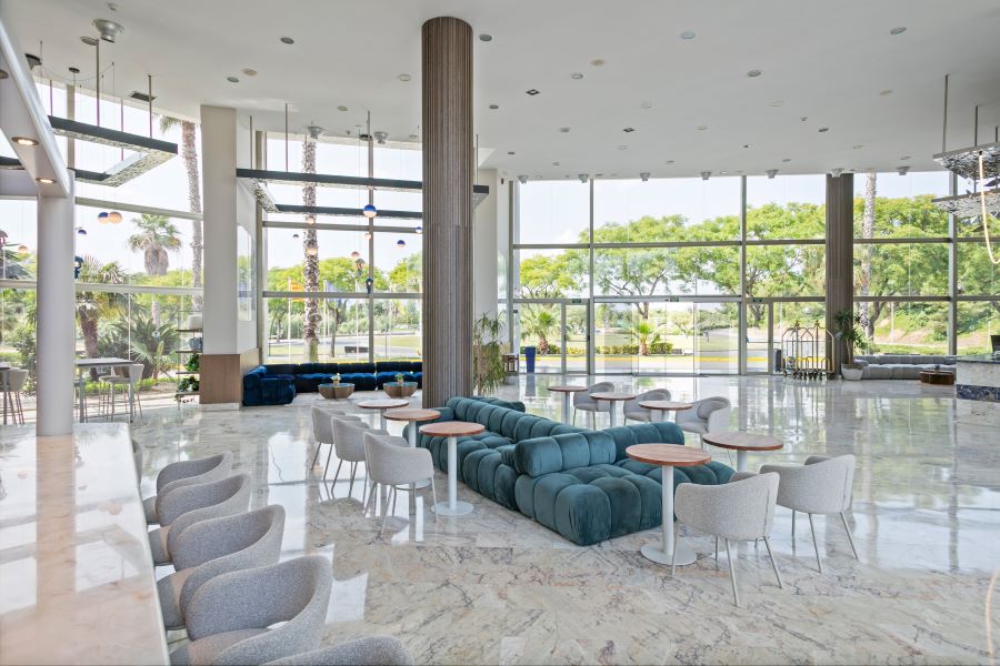 Lobby area with green chairs at Sol Costa Daurada by MeliaSol Costa Daurada by Melia