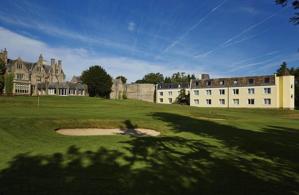 Exterior view of St Pierre Marriott Hotel and Country Club overlooking the green which is protected by bunkers