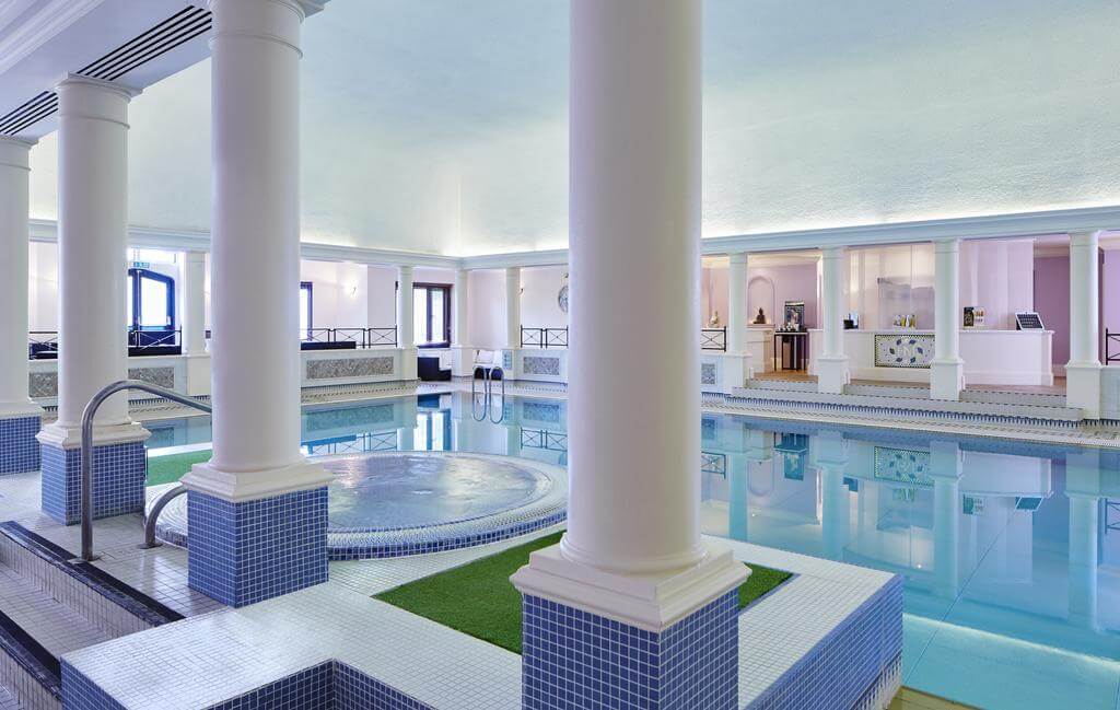 Indoor swimming pool and Jacuzzi at Hanbury Manor Golf Marriott Hotel And Country Club