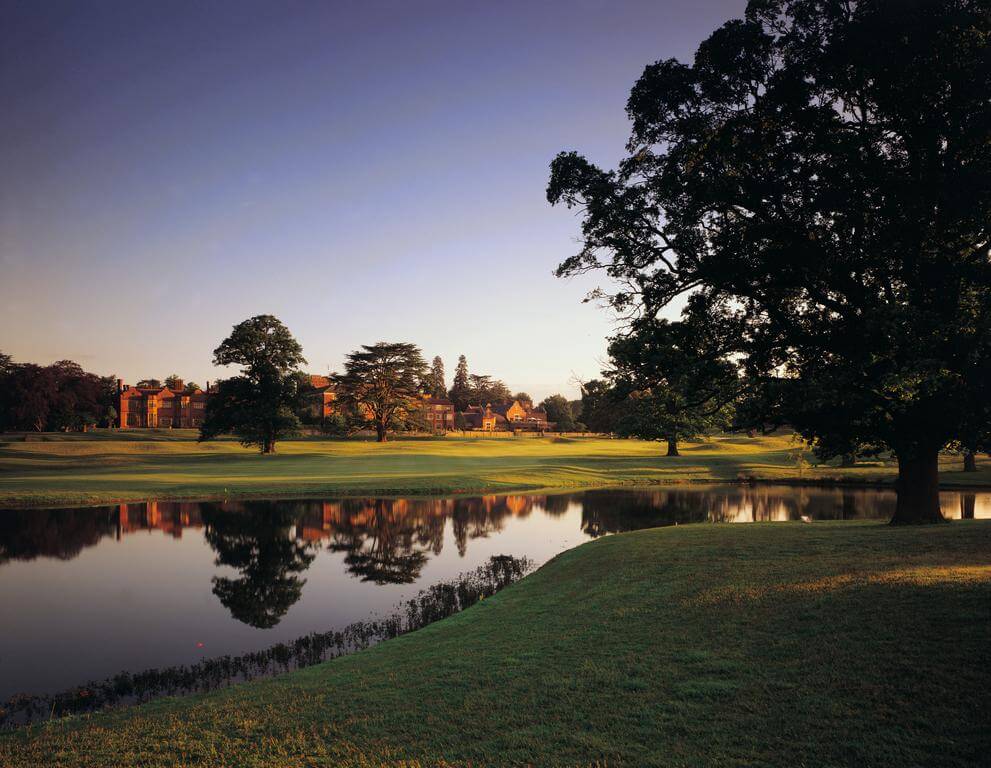 Lake with golf course and Hanbury Manor Golf Marriott Hotel And Country Club in the background