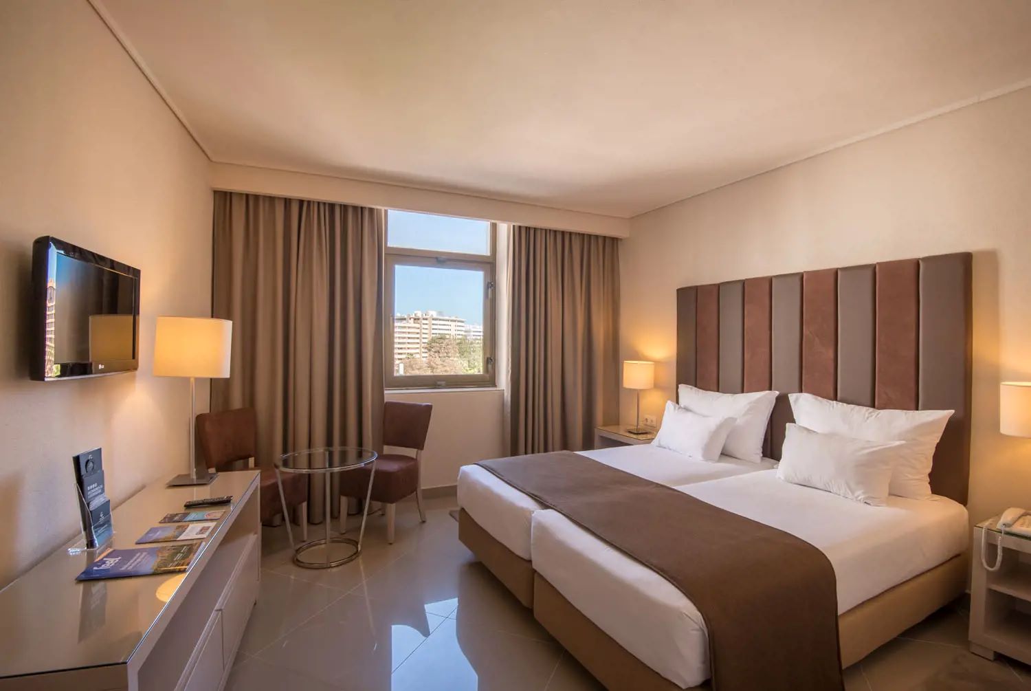 Bedroom with twin beds in the Vila Gale Ampalius hotel in Vilamoura, Portugal