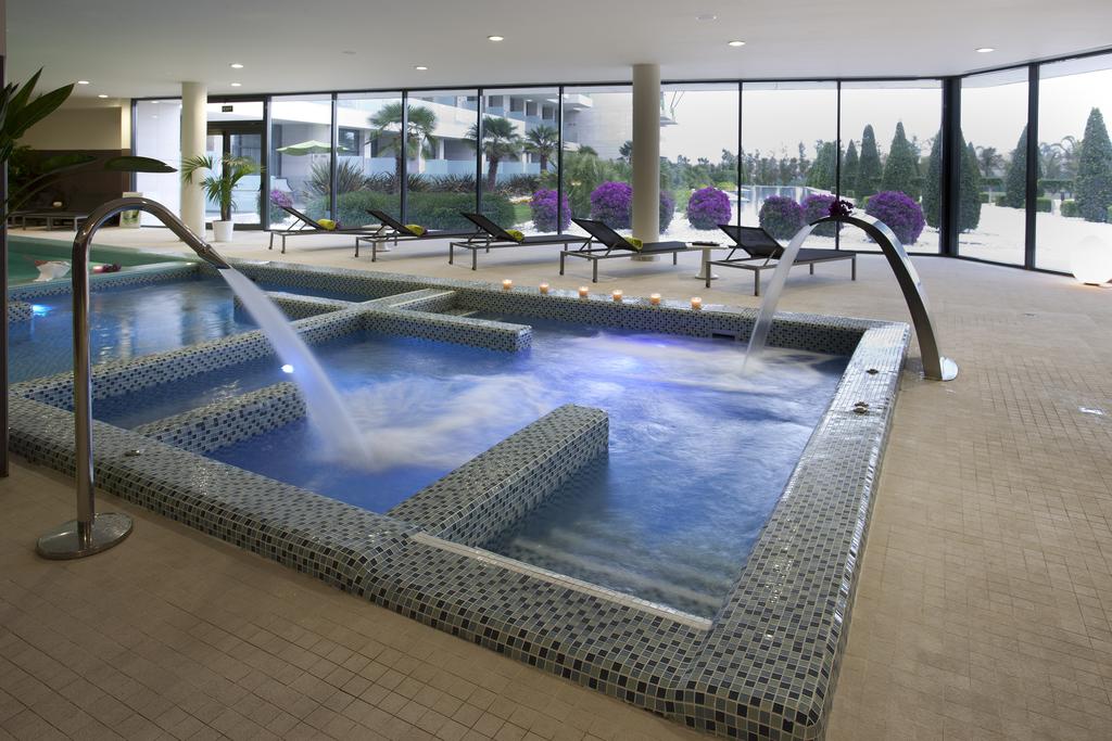 Indoor spa with sun loungers at Hotel La Finca Golf And Spa