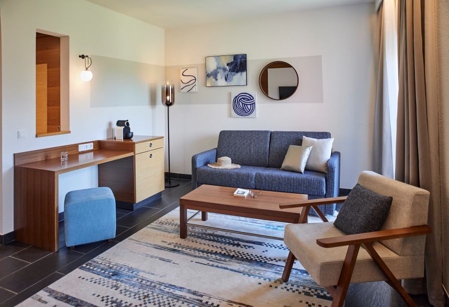 Sofa and chair in living area of superior bedroom at Robinson Quinta Da Ria