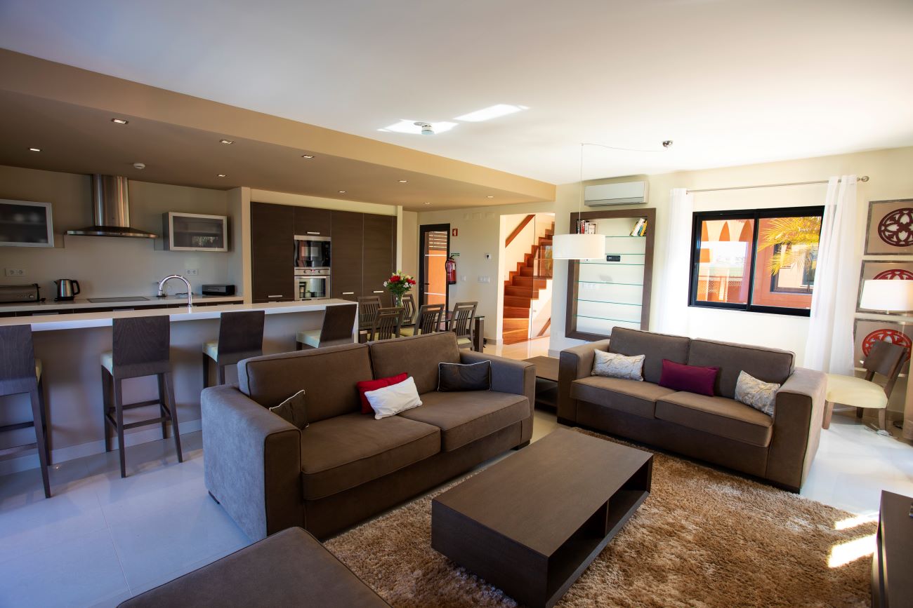 Living room and kitchen in villa at Amendoeira Golf Resort in the Algarve