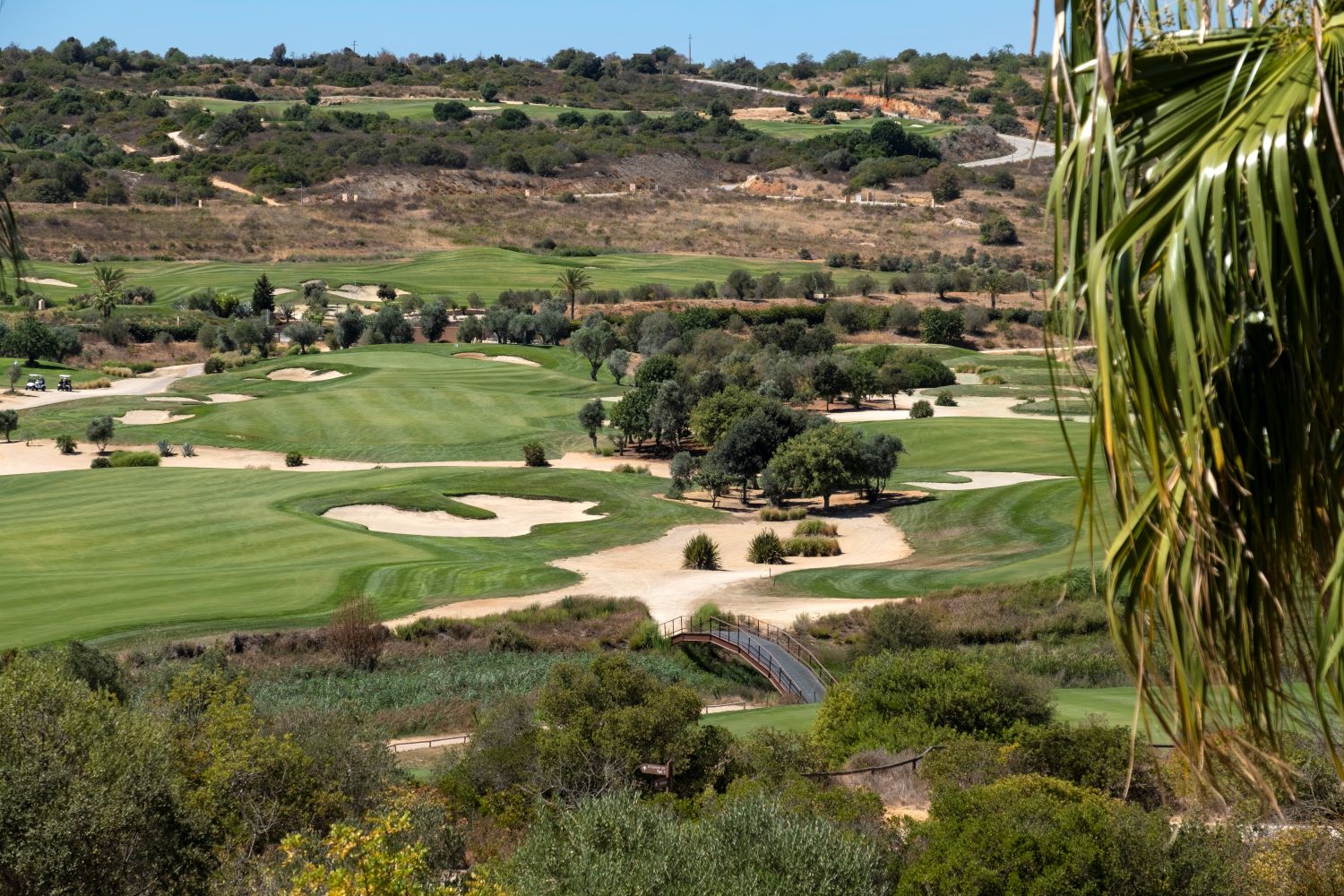 Bunkers and trees on the course at Faldo golf course