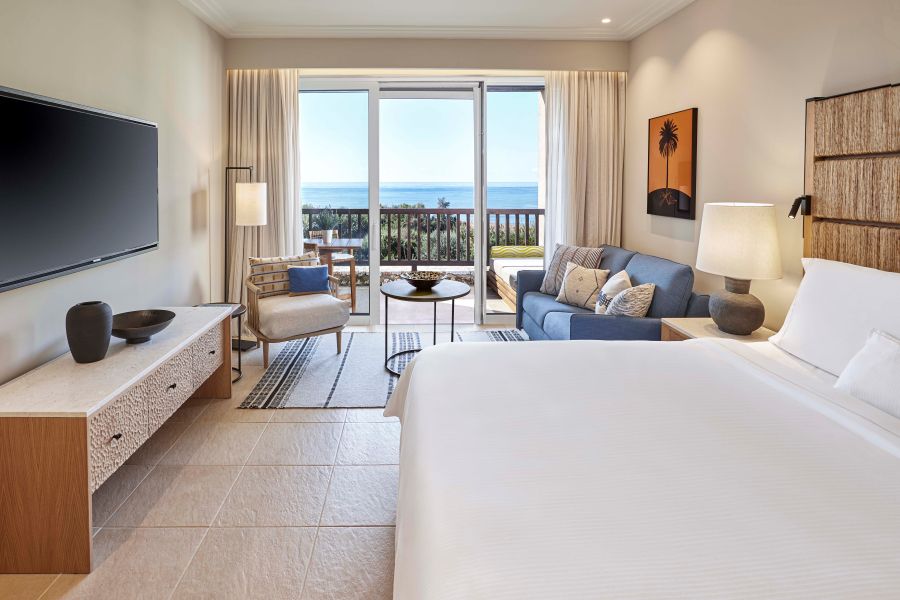 The Westin Resort Costa Navarino bedroom with television on the wall