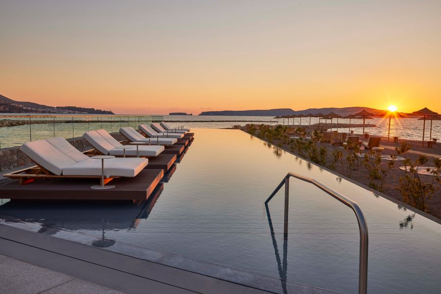 Sun loungers overlooking the pool at W Costa Navarino