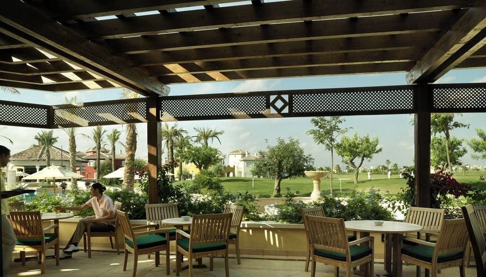 Outside tables and chairs at Ona Mar Menor Golf And Spa Resort in Murcia, Spain