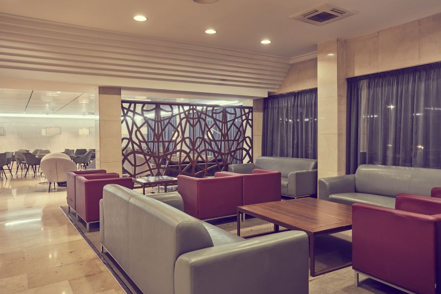 Sofas and tables at Sandos Griego Hotel reception area