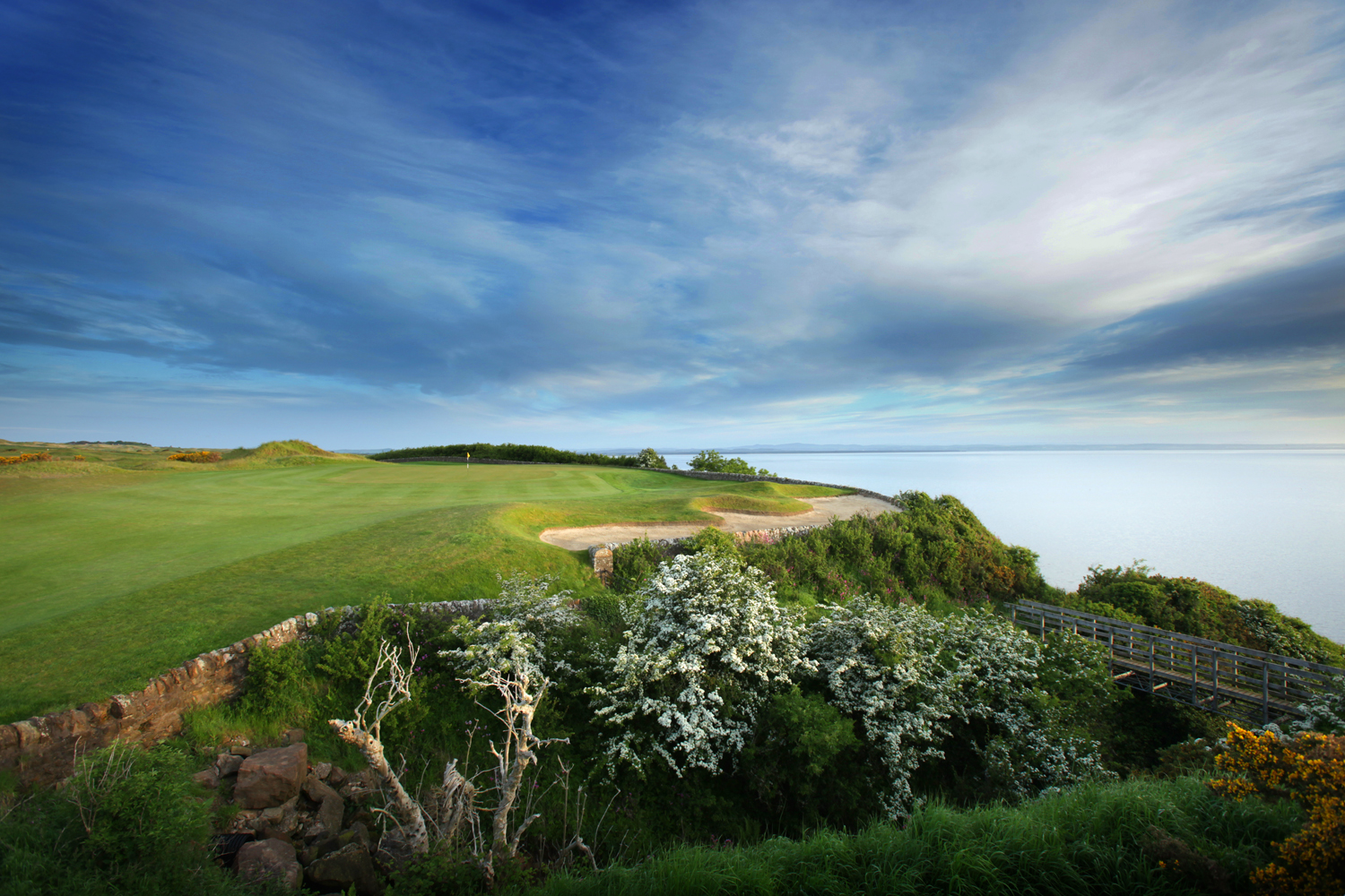 The kittocks golf course in scotland with sea in the background