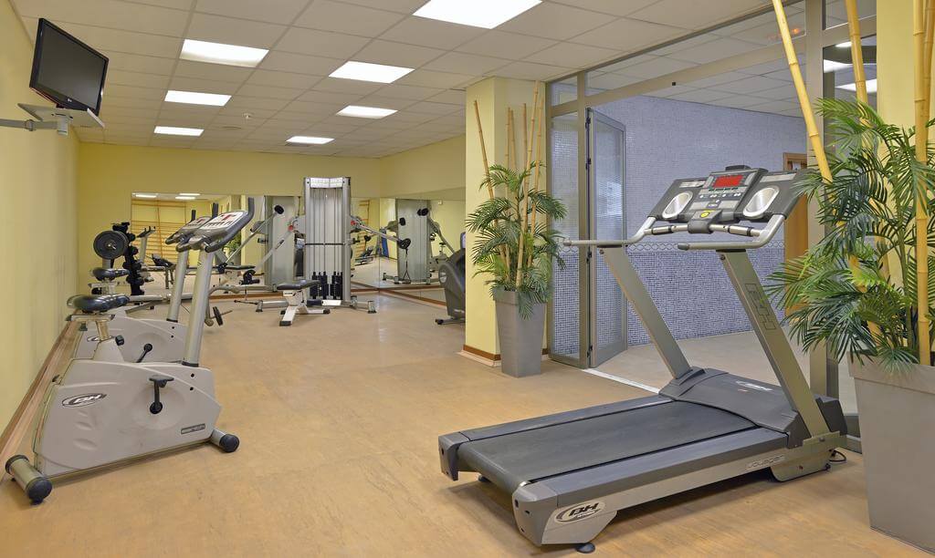 Gym with exercise bike and treadmill at Sol Costa Daurada By Melia