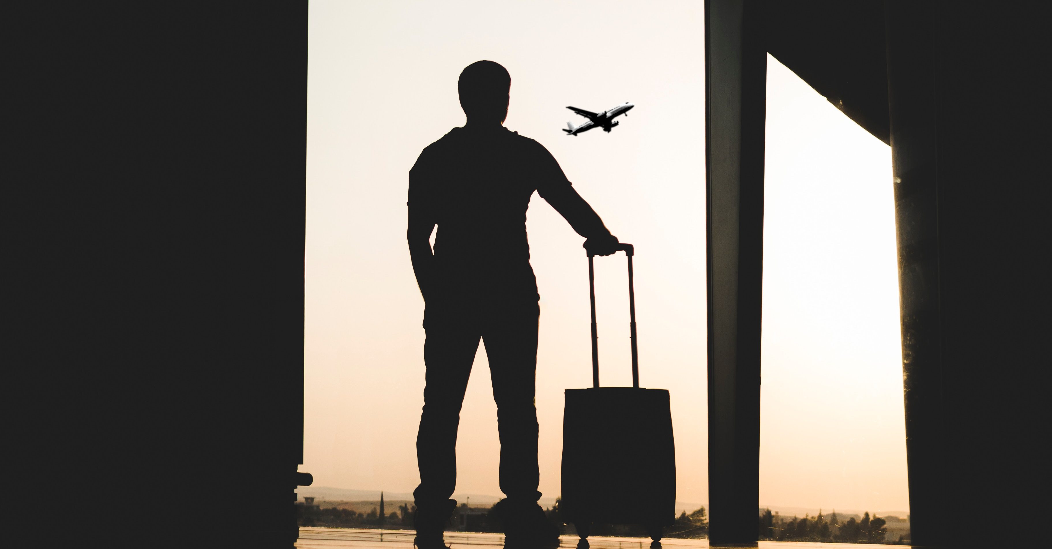 A man standing in a departure lounge